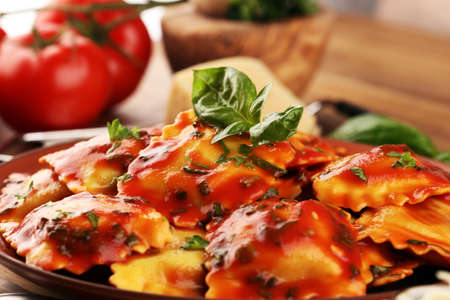 Ravioli with tomato sauce and basil. Homemade italian ravioli for dinnerの写真素材