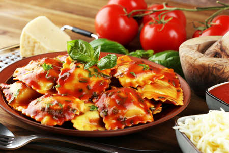 Ravioli with tomato sauce and basil. Homemade italian ravioli for dinnerの写真素材