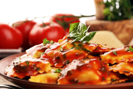 Ravioli with tomato sauce and basil. Homemade italian ravioli for dinnerの写真素材