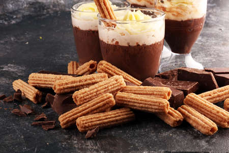 Traditional Spanish dessert churros with sugar and chocolate.の写真素材