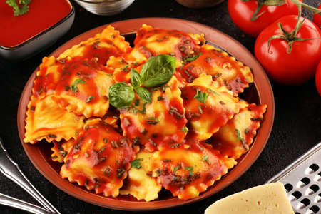 Ravioli with tomato sauce and basil. Homemade italian ravioli for dinnerの写真素材