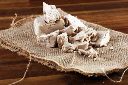 Dry yeast crumbled and yeast cube block for baking.の写真素材