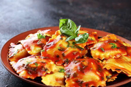 Ravioli with tomato sauce and basil. Homemade italian ravioli for dinnerの写真素材