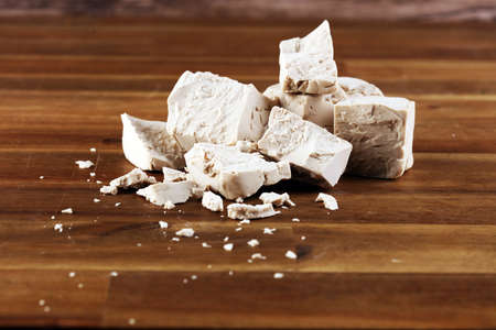 Dry yeast crumbled and yeast cube block for baking.の写真素材
