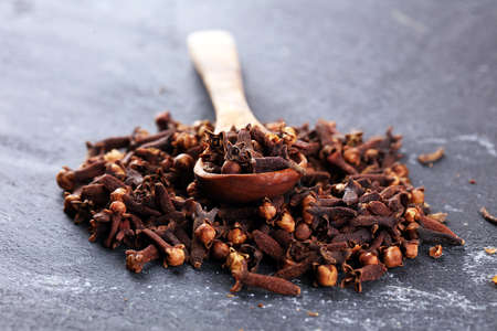 freshly dryed cloves spice texture on vintage rustic backgroundの写真素材