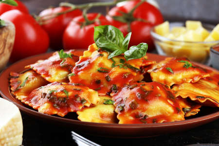 Ravioli with tomato sauce and basil. Homemade italian ravioli for dinnerの写真素材