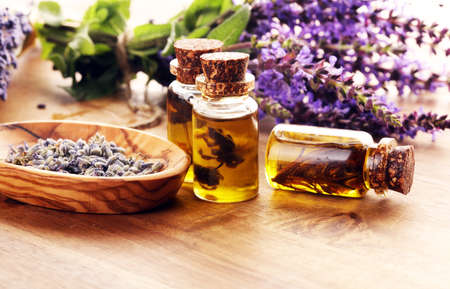 lavender herbal oil and lavender flowers. bottle of lavender massage oil for aromatherapy beauty treatmentの写真素材