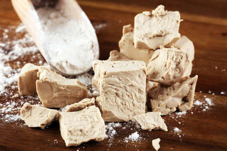 Dry yeast crumbled and yeast cube block for baking.の写真素材