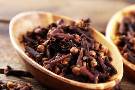 freshly dryed cloves spice texture on vintage rustic backgroundの写真素材