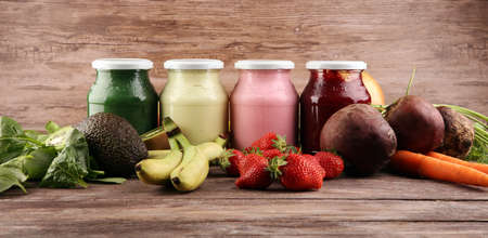 Multicolored smoothies and juices from vegetables, greens, fruits and berries, healthy food background. Detox and dieting, clean eating, healthy lifestyle conceptの写真素材