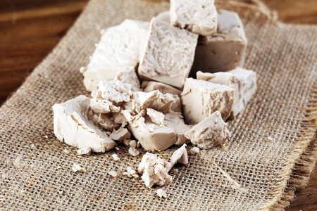 Dry yeast crumbled and yeast cube block for baking.の写真素材