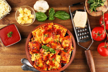 Ravioli with tomato sauce and basil. Homemade italian ravioli for dinnerの写真素材