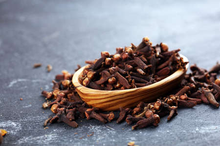 freshly dryed cloves spice texture on vintage rustic backgroundの写真素材