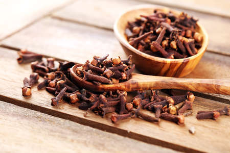 freshly dryed cloves spice texture on vintage rustic backgroundの写真素材