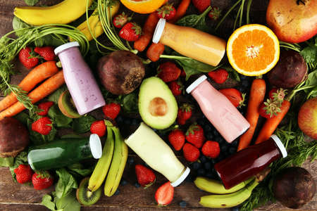 Multicolored smoothies and juices from vegetables, greens, fruits and berries, healthy food background. Detox and dieting, clean eating, healthy lifestyle conceptの写真素材