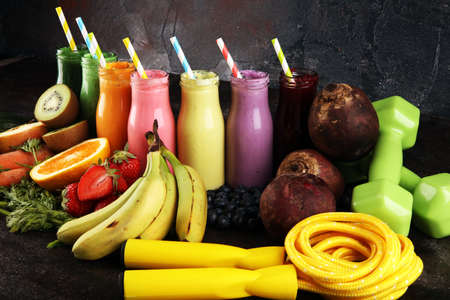 Multicolored smoothies and juices from vegetables, greens, fruits and berries, healthy food background. Detox and dieting, clean eating, healthy lifestyle conceptの写真素材