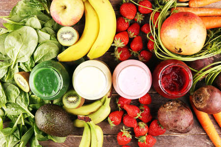 Multicolored smoothies and juices from vegetables, greens, fruits and berries, healthy food background. Detox and dieting, clean eating, healthy lifestyle conceptの写真素材