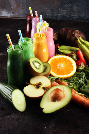 Multicolored smoothies and juices from vegetables, greens, fruits and berries, healthy food background. Detox and dieting, clean eating, healthy lifestyle conceptの写真素材