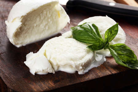 Mozzarella. Traditional italian food - white ball mozzarella buffalo Italian soft cheese with basilの写真素材