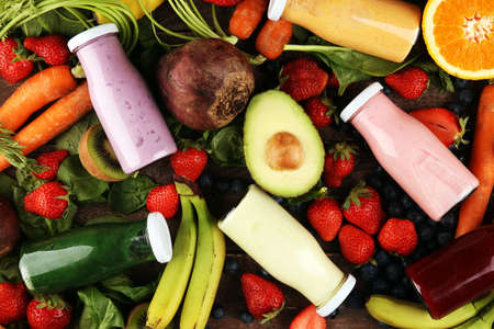 Multicolored smoothies and juices from vegetables, greens, fruits and berries, healthy food background. Detox and dieting, clean eating, healthy lifestyle conceptの写真素材