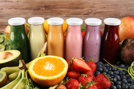 Multicolored smoothies and juices from vegetables, greens, fruits and berries, healthy food background. Detox and dieting, clean eating, healthy lifestyle conceptの写真素材