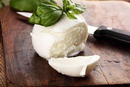Mozzarella. Traditional italian food - white ball mozzarella buffalo Italian soft cheese with basilの写真素材