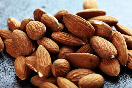 Almonds on a rustic table and almond in bowl. Healthy almondsの写真素材