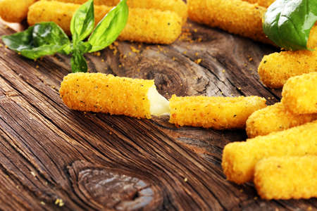 Breaded mozzarella cheese sticks for delicious mealの写真素材