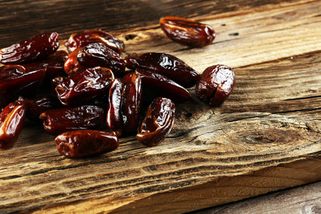 Raw Organic Medjool Dates Ready to Eat. Healthy vegetarian food on background