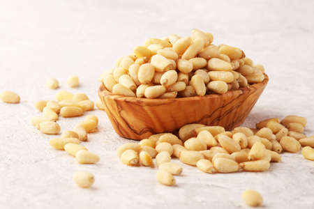Some fresh Pine Nuts on vintage background. unshelled healthy vegetarian foodの写真素材