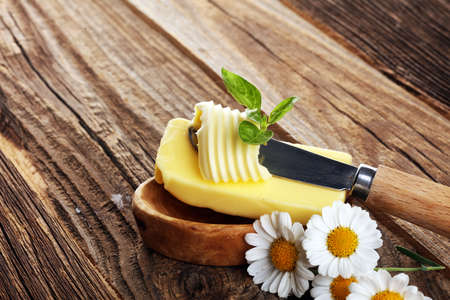 butter swirls. margarine or spread, fatty natural dairy product. High-calorie food for cooking and eating dairyの写真素材