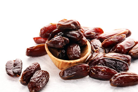 Raw Organic Medjool Dates Ready to Eat. Healthy vegetarian food on background