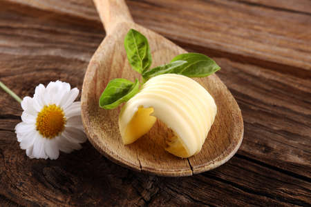butter swirls. margarine or spread, fatty natural dairy product. High-calorie food for cooking and eating dairyの写真素材