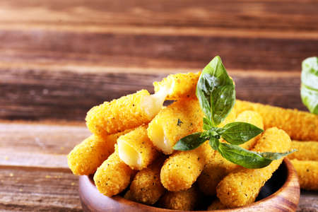 Breaded mozzarella cheese sticks for delicious mealの写真素材