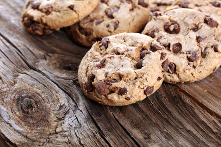 Chocolate cookies on wooden table. Chocolate chip cookies shot on woodの写真素材