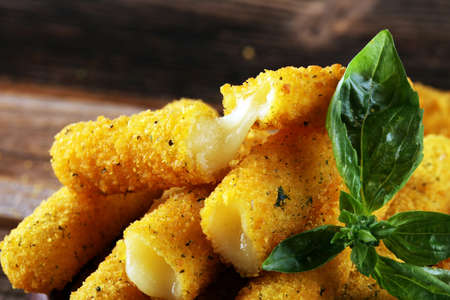 Breaded mozzarella cheese sticks for delicious mealの写真素材