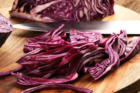 Chopped fresh red cabbage. Prepare sliced vegetable for cooking purple cabbage salad or coleslaw. Homemade fresh food concept.の写真素材