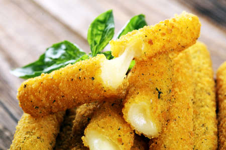 Breaded mozzarella cheese sticks for delicious mealの写真素材