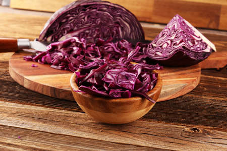 Chopped fresh red cabbage. Prepare sliced vegetable for cooking purple cabbage salad or coleslaw. Homemade fresh food concept.の写真素材