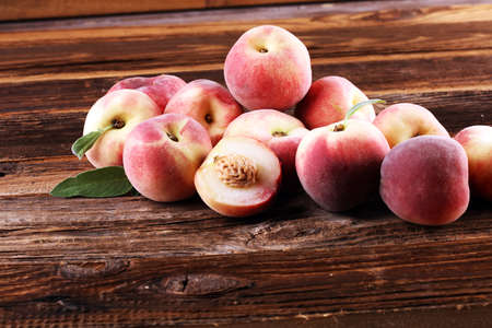 A group of ripe peaches on table. Fresh peach conceptの写真素材