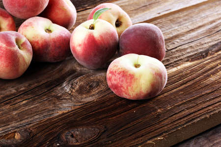 A group of ripe peaches on table. Fresh peach conceptの写真素材