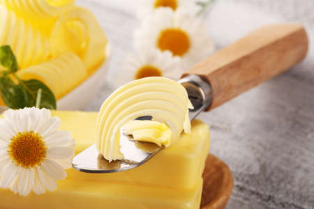 butter swirls. margarine or spread, fatty natural dairy product. High-calorie food for cooking and eating dairyの写真素材