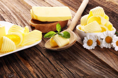 butter swirls. margarine or spread, fatty natural dairy product. High-calorie food for cooking and eating dairyの写真素材