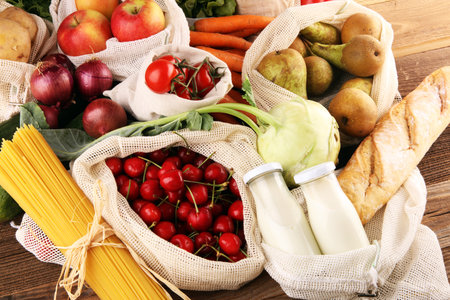 eco natural bags with vegetables, eco friendly, flat lay. sustainable lifestyle concept. zero waste...