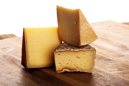 various types of cheese on vintage table