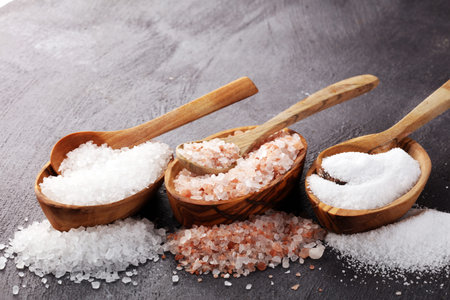Sea salt and himalayan salt. Crystals of salt on rustic table