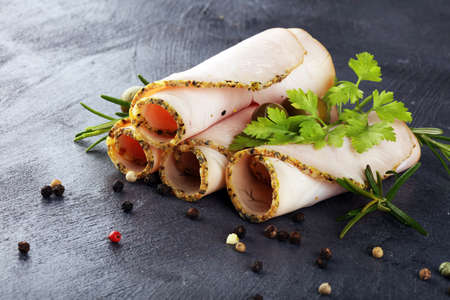 Sliced Chicken Breast fillet or turkey breast on backgroundの写真素材