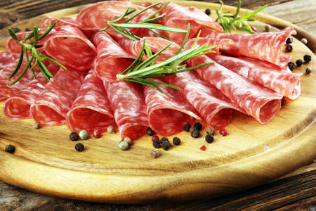 thinly sliced salami. delicious snack rustic salami.の写真素材