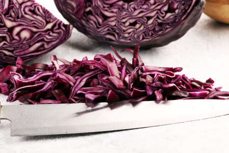 Chopped fresh red cabbage. Prepare sliced vegetable for cooking purple cabbage salad or coleslaw. Homemade fresh food concept.の写真素材