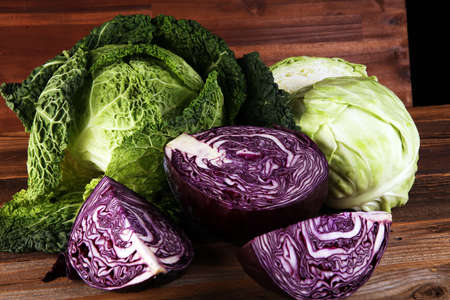 Three fresh organic cabbage heads. Antioxidant balanced diet eating with red cabbage, white cabbage and fresh savoyの写真素材